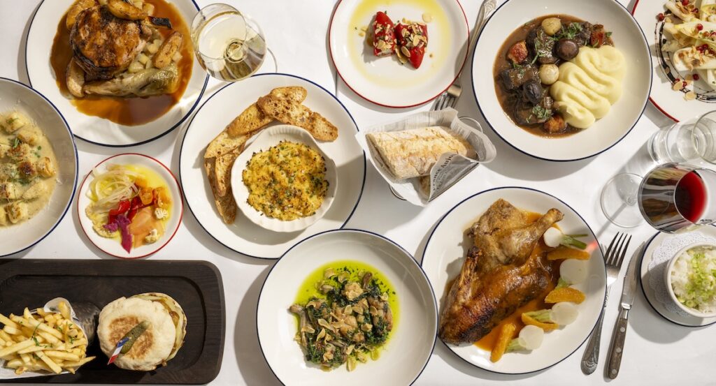 Variety of French dishes against white tablecloth