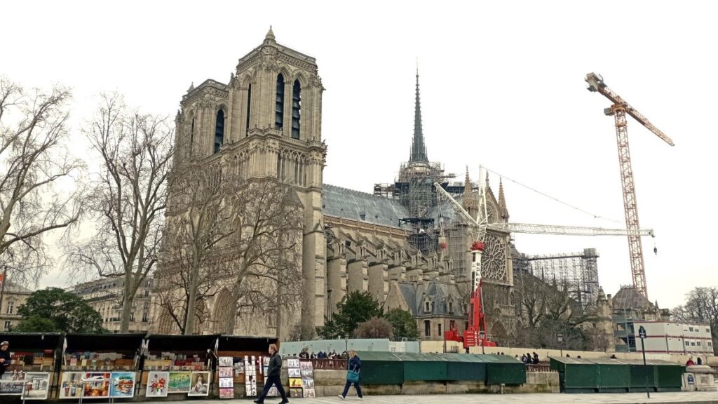 Notre Dame seen from the Left Bank of the Seine. The cranes around it show that outside renovations continue.