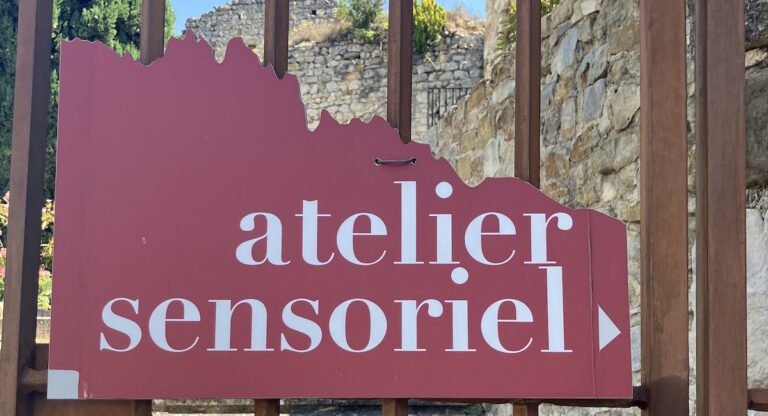 Sign on gate for the Atelier Sensoriel