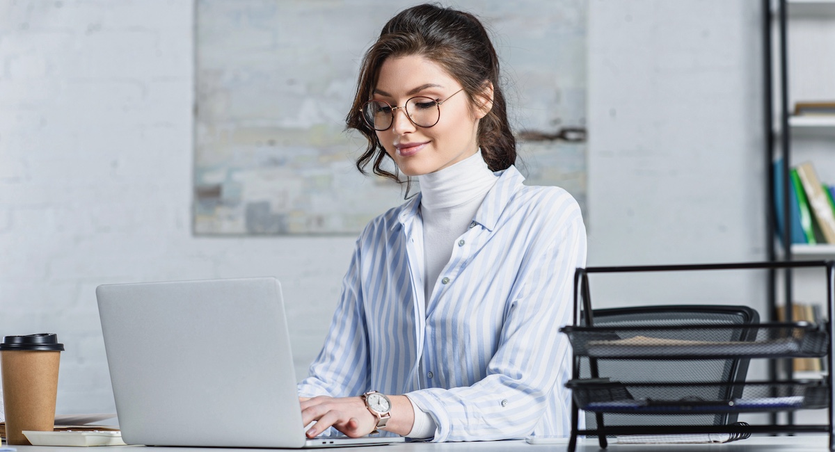 Woman typing on a laptop computer