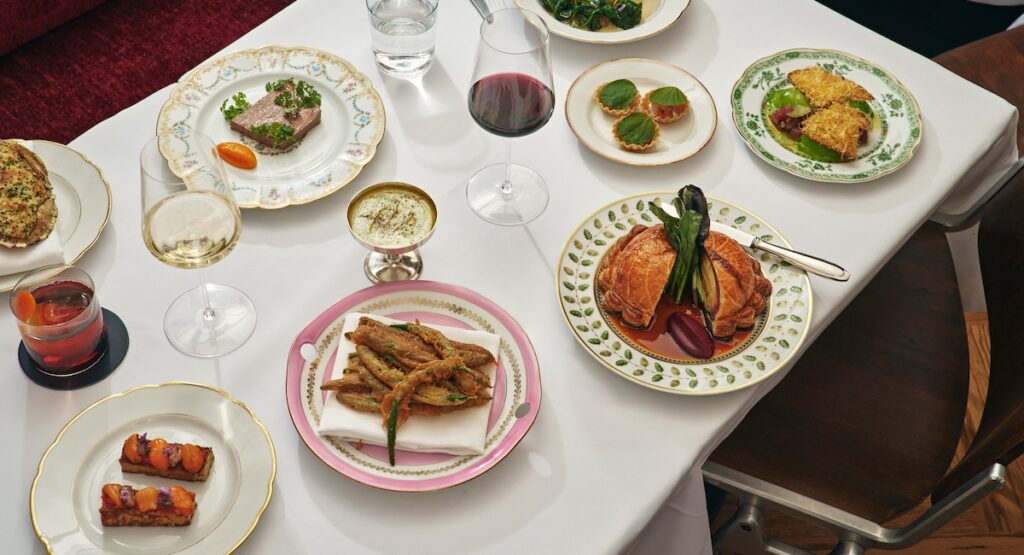 Assortment of dishes on white tablecloth