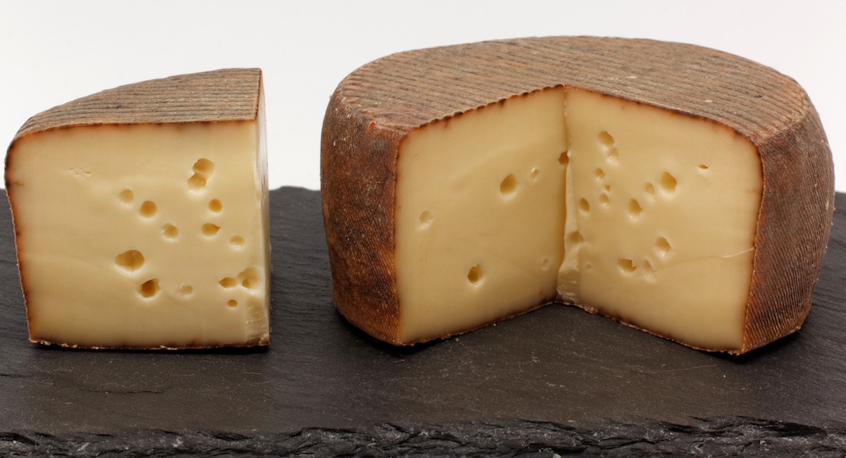 Trappe d’Echourgnac cheese with slice cut out