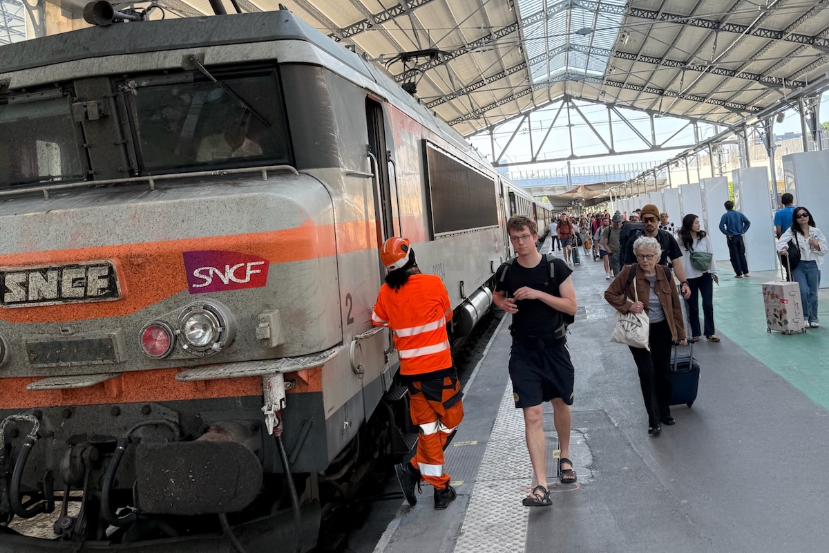People boarding SNCF train on platform
