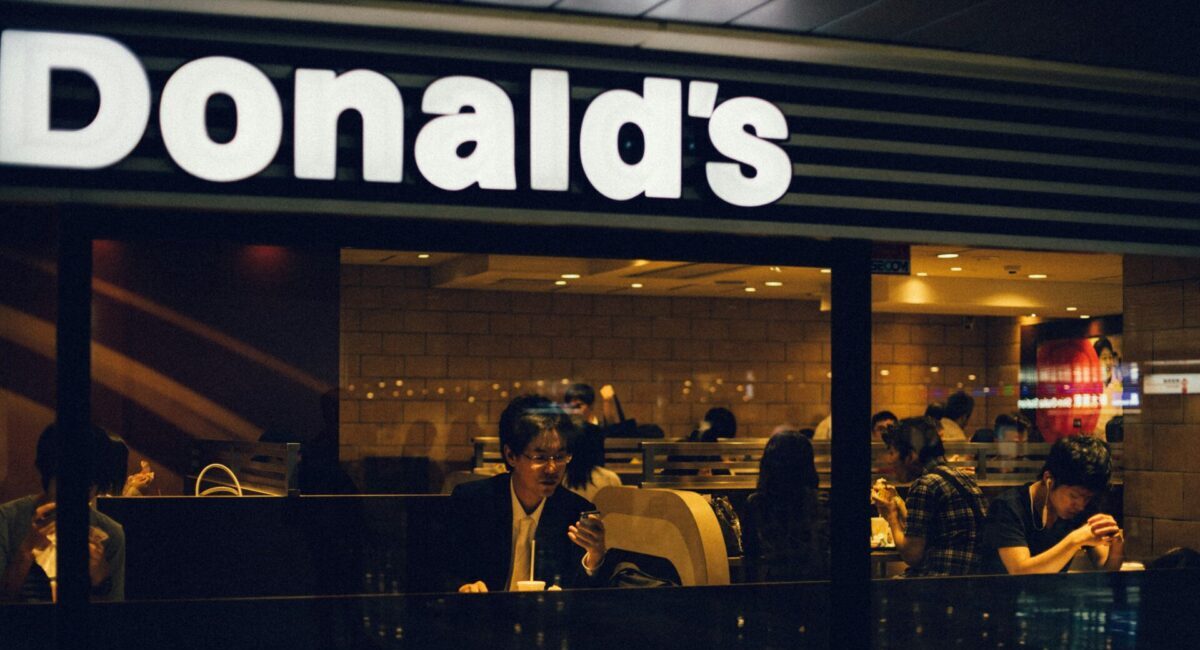 person eating at a mcdonalds at night