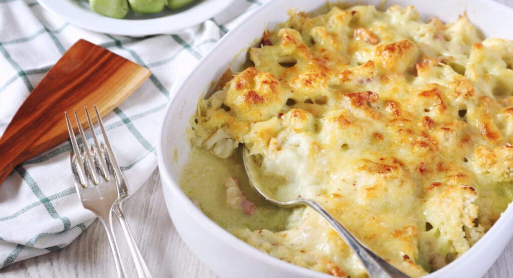 A partially eaten dish of cauliflower gratin.