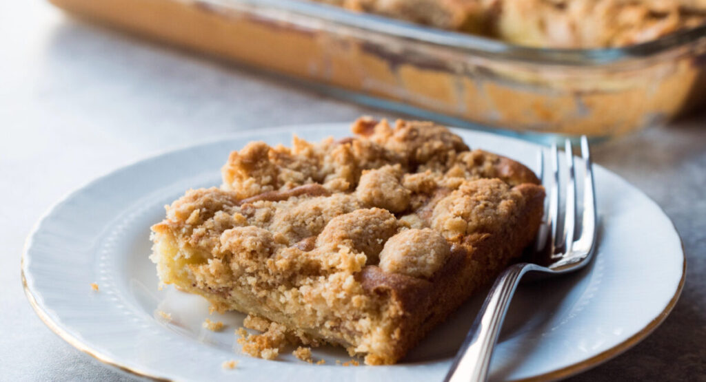 A slice of crumble on a plate.