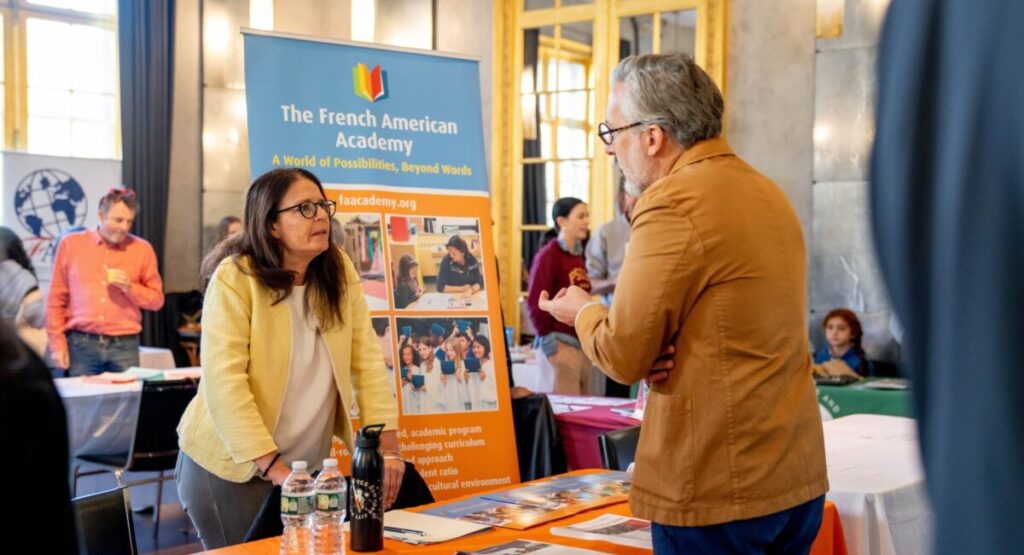 People talking at Bilingual Education Fair