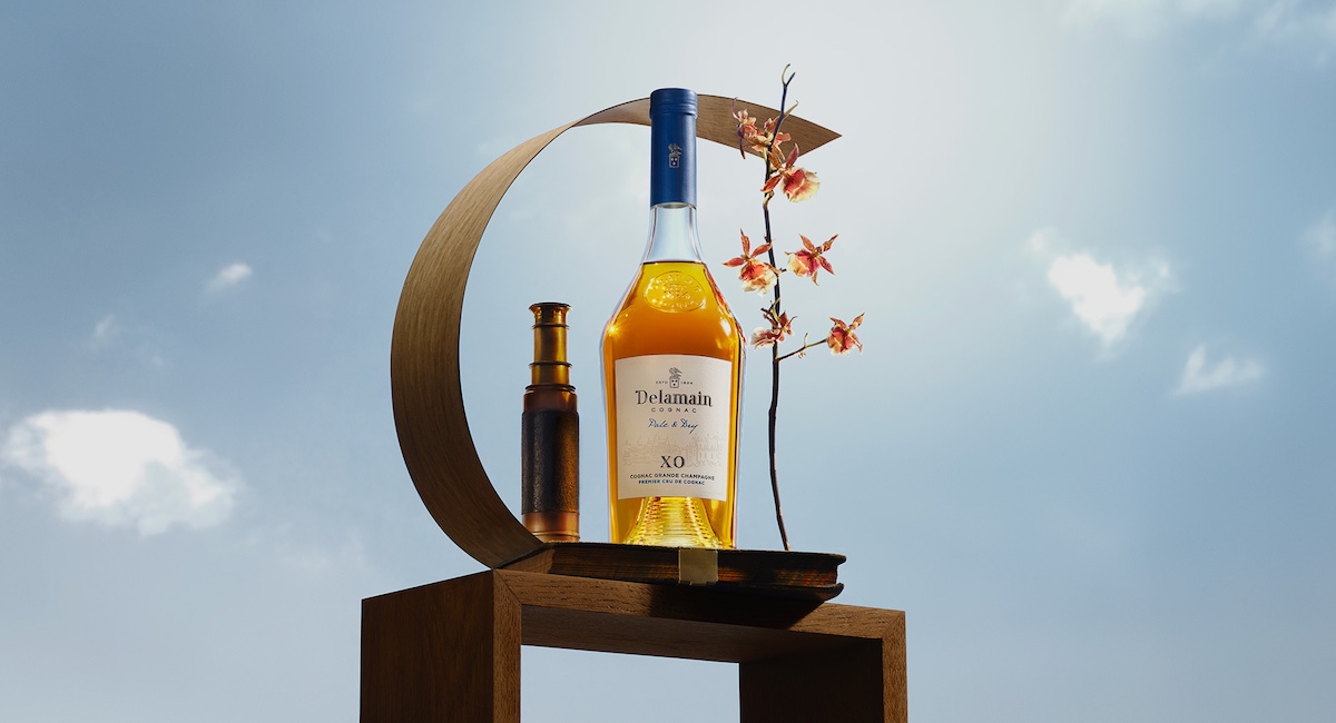 Bottle of cognac with blue sky background