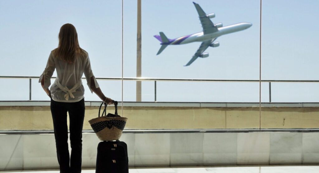 One girl at the airport window.