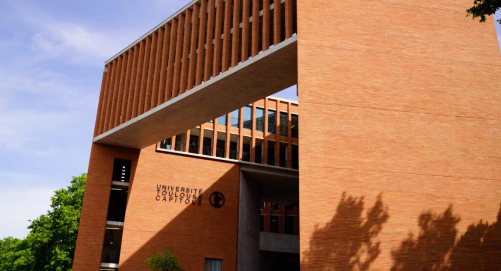 The Toulouse Capitole law school with its red brick facade.