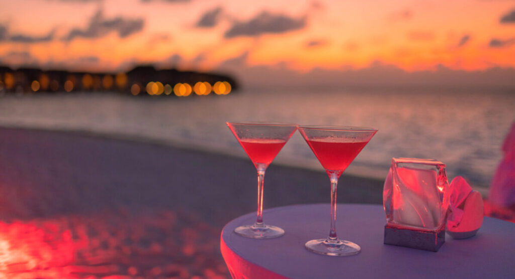 Cocktails ont seabeach with sunset.