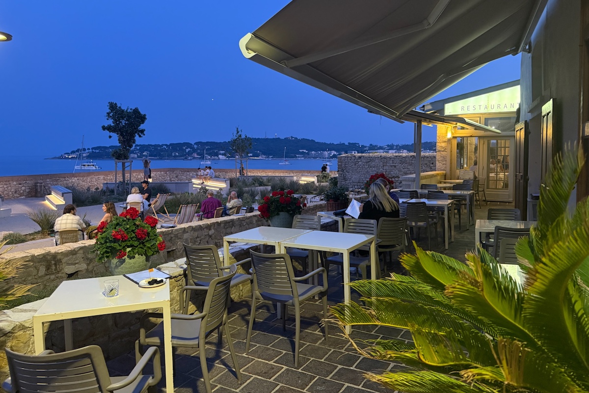 Restaurant in Antibes at night with ocean view