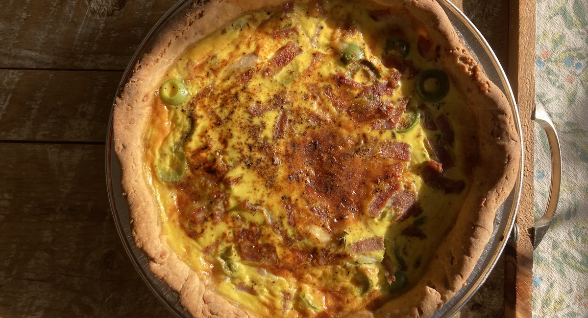 Quiche in golden light viewed from above