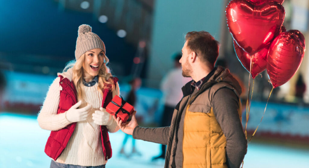 A man offering a gift to his girldfriend.