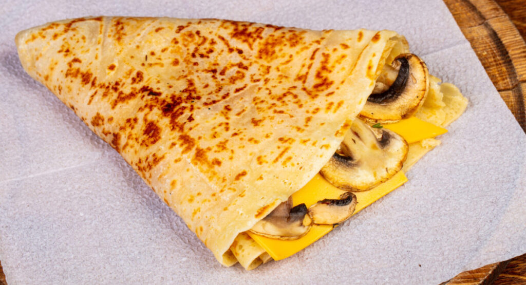 Pancake with mushrooms and cheese.