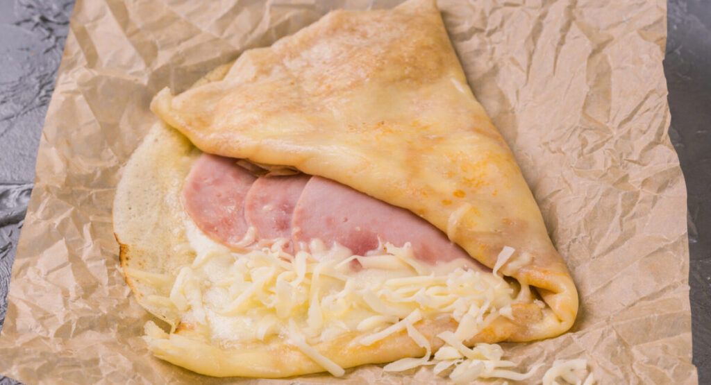 French crepe pancakes stuffed ham and cheese.