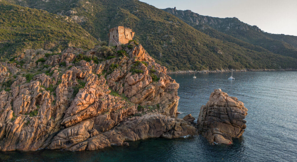 Aerial view town and ruins of the Genoese tower in Corsica.
