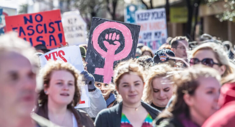 Woman Holding signs.