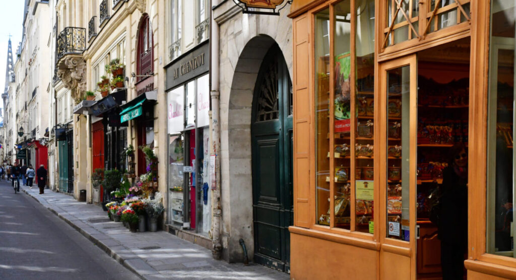 a street lined with stores in paris