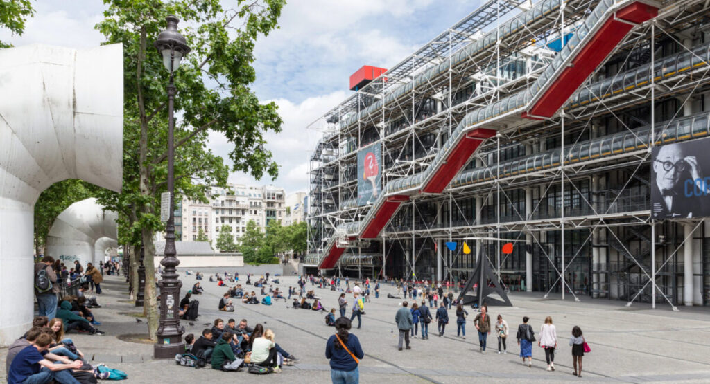 Tourists relaxing in front of the Centre Pompidou in Paris.