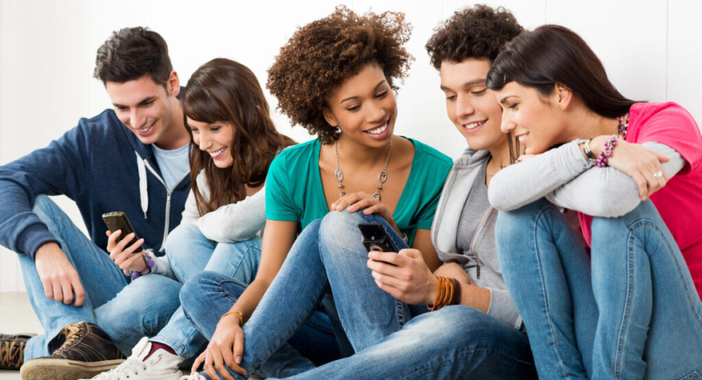 Friends Looking At Cell Phone.