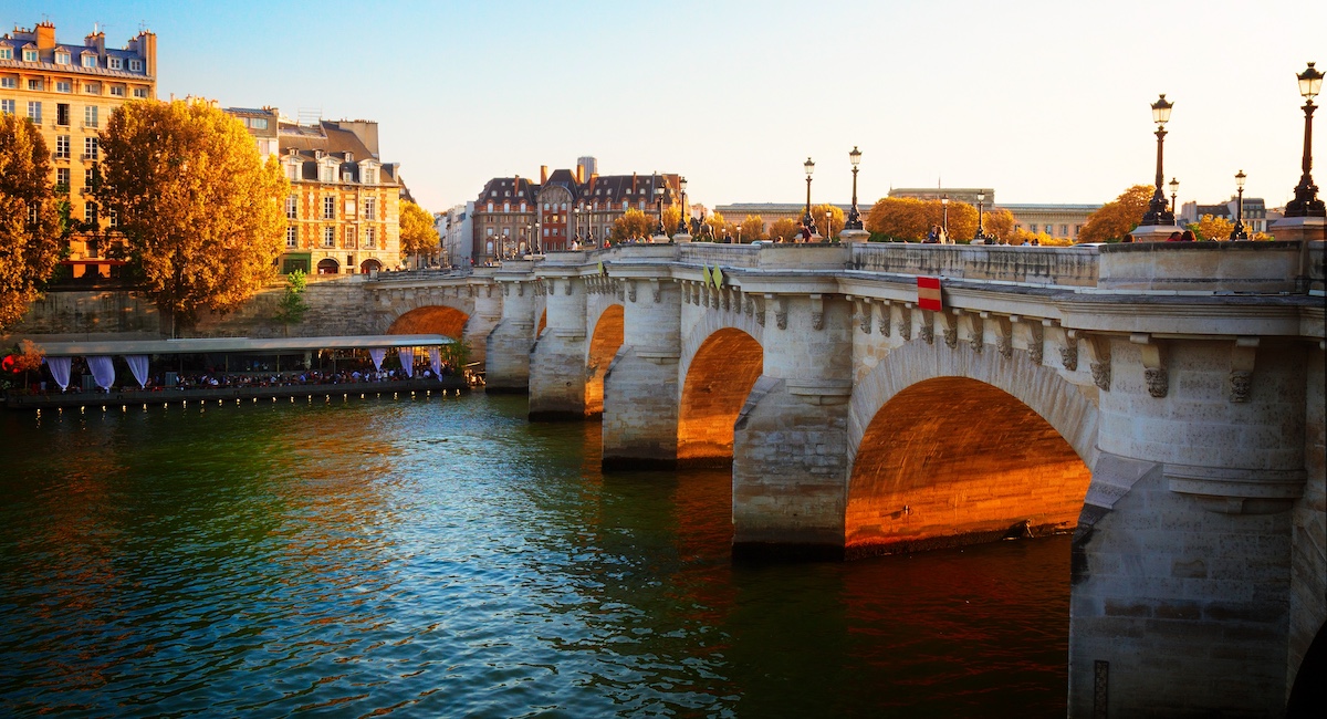 The Pont Neuf bridge in Paris at sunset.