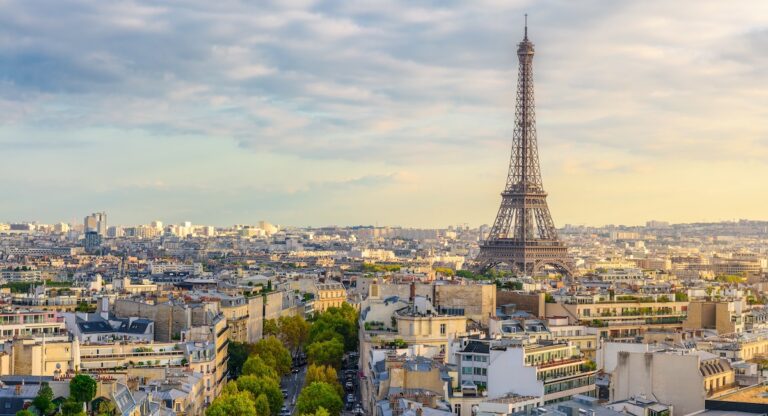 Aerial view of Paris with Eiffel Tower and Champs Elysees from the roof of the Triumphal Arch.