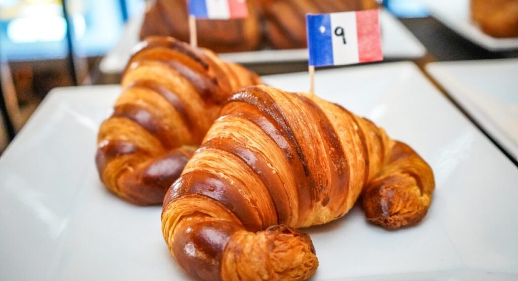 Croissants on white plate.