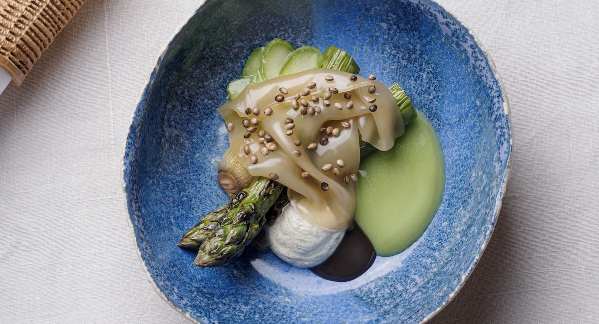 Asparagus dish on blue plate.