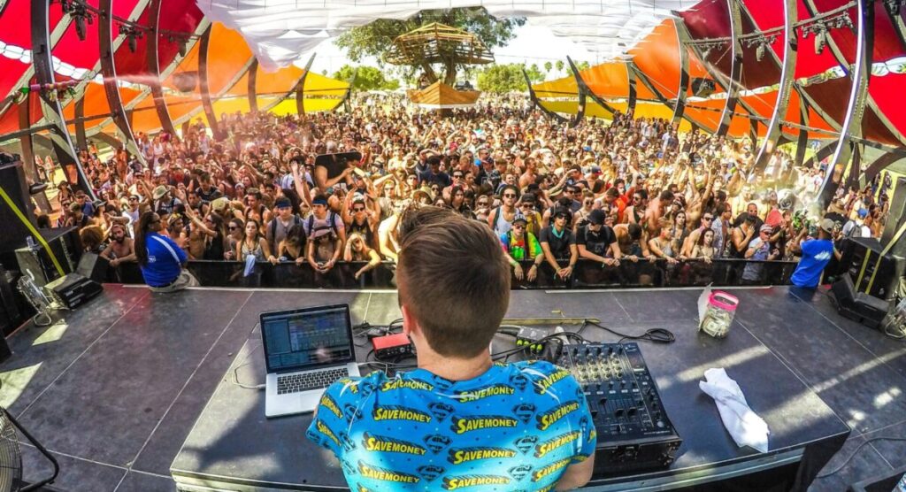 A DJ mixing in front of a crowd.