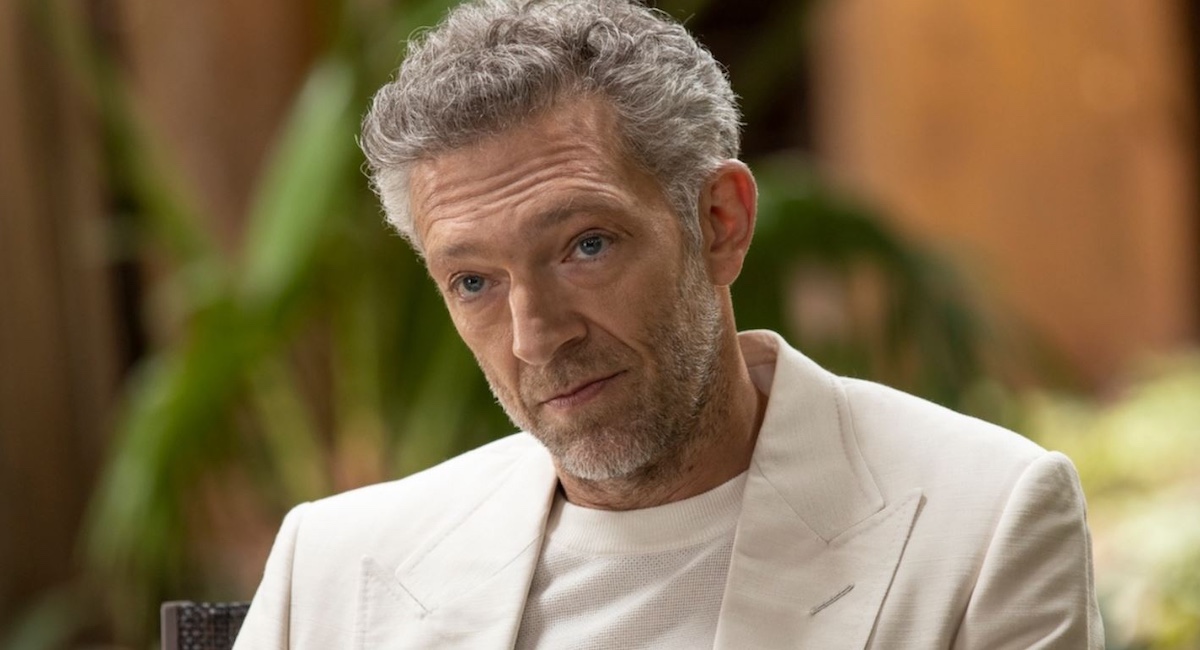 Vincent Cassel in white suit.