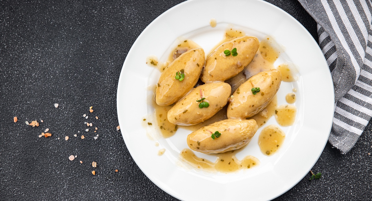 Fish quenelles typical of Lyon's Bouchon menus.