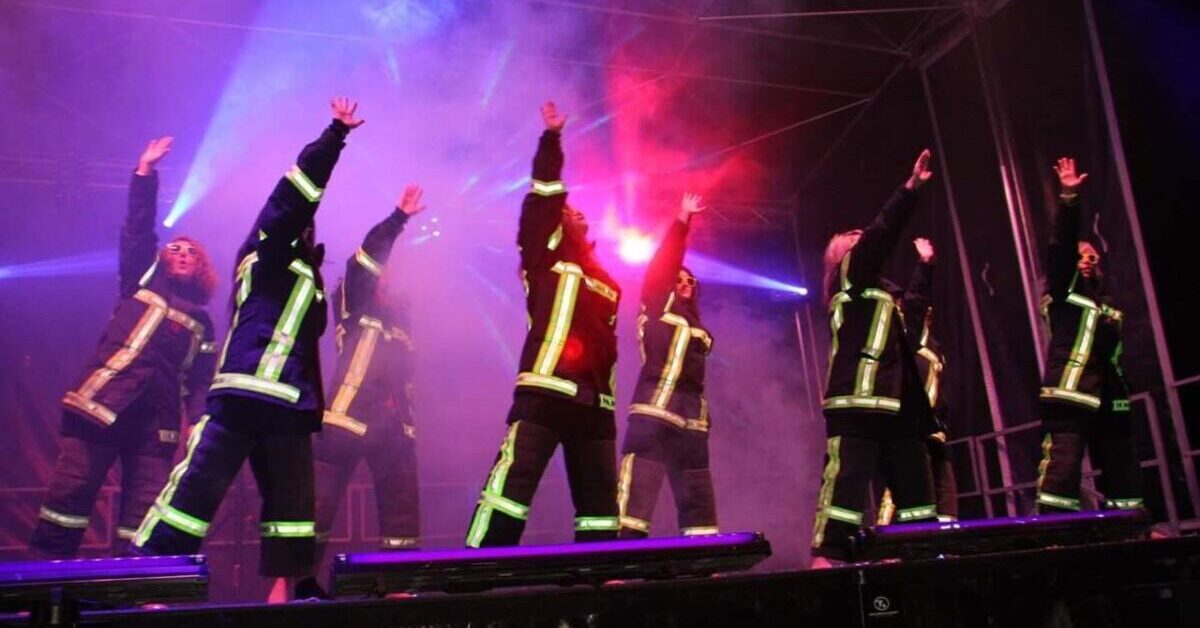 Firefighters dancing.