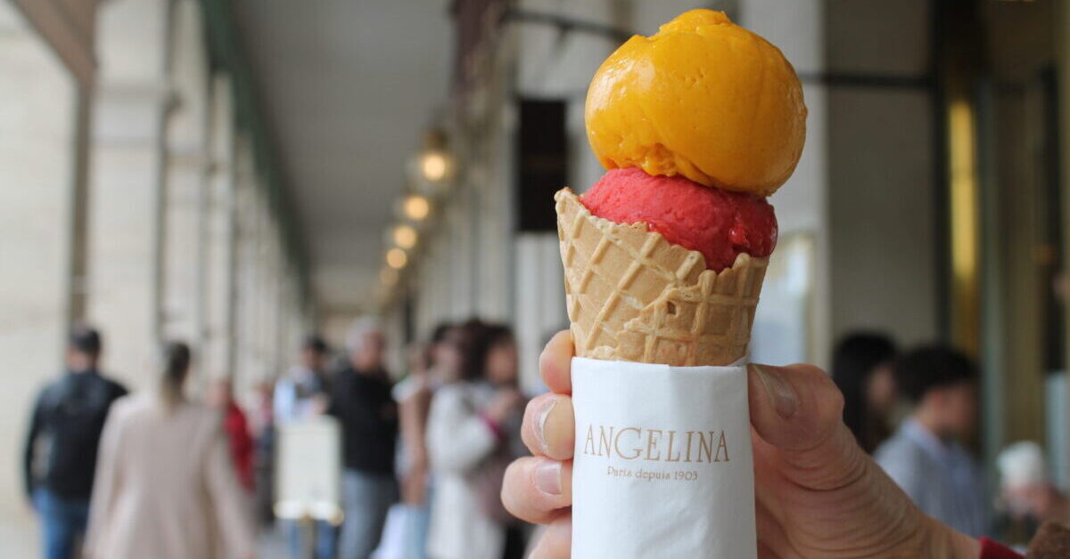 Ice cream with colorful scoops, held with Angelina brand napkin