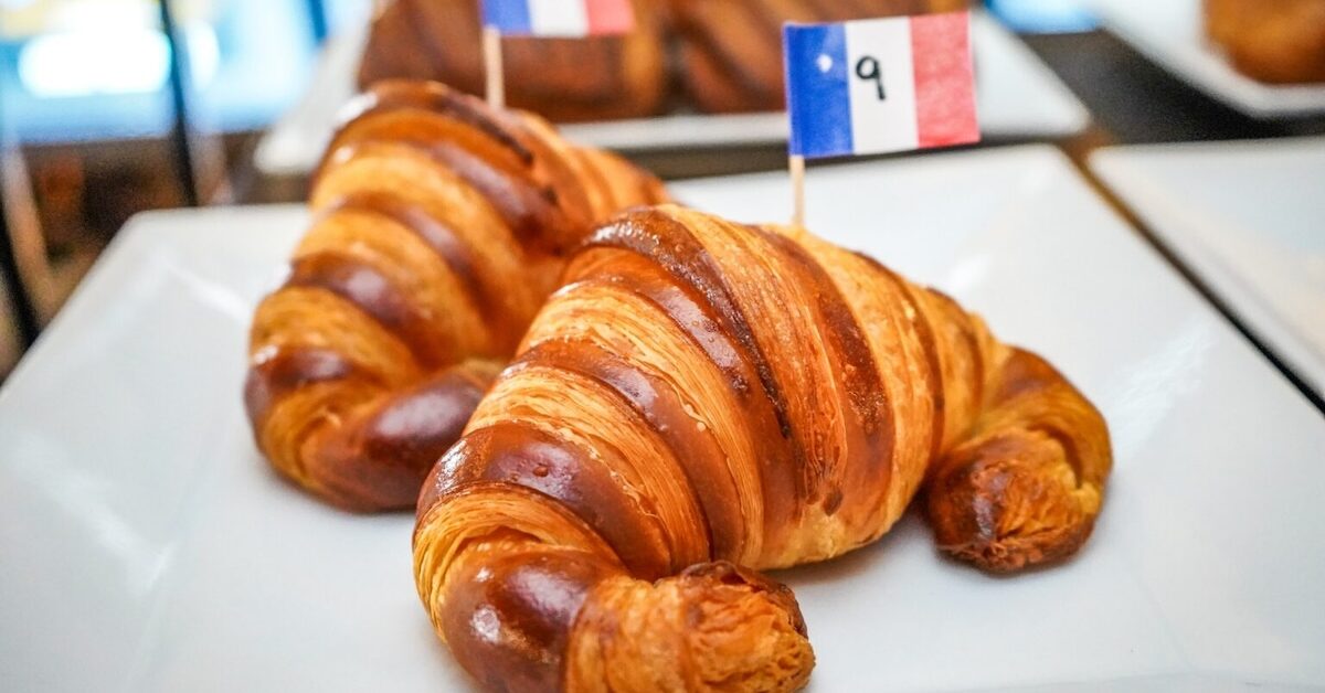 Croissants on white plate.
