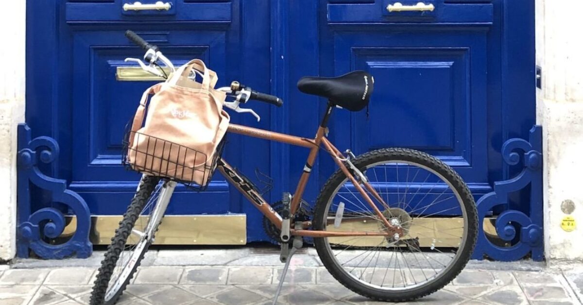 A bicycle parked on the side of a building