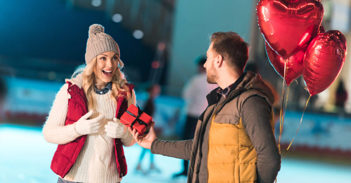 A man offering a gift to his girldfriend.