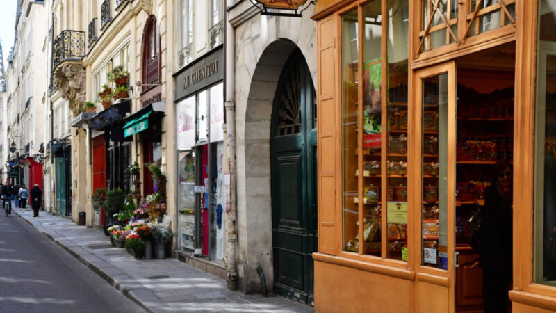 a street lined with stores in paris