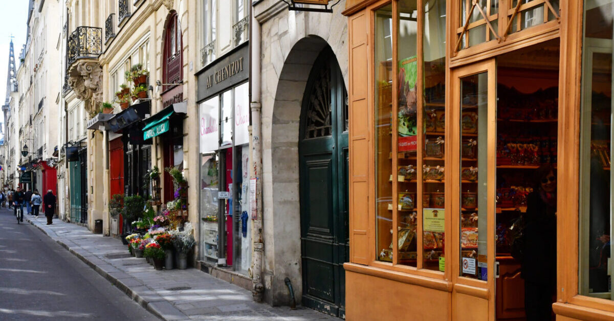 a street lined with stores in paris