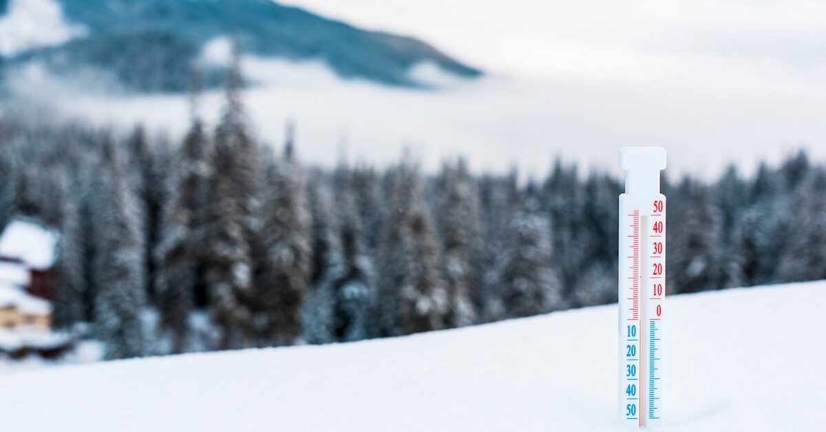Thermometer in the snowy Alps