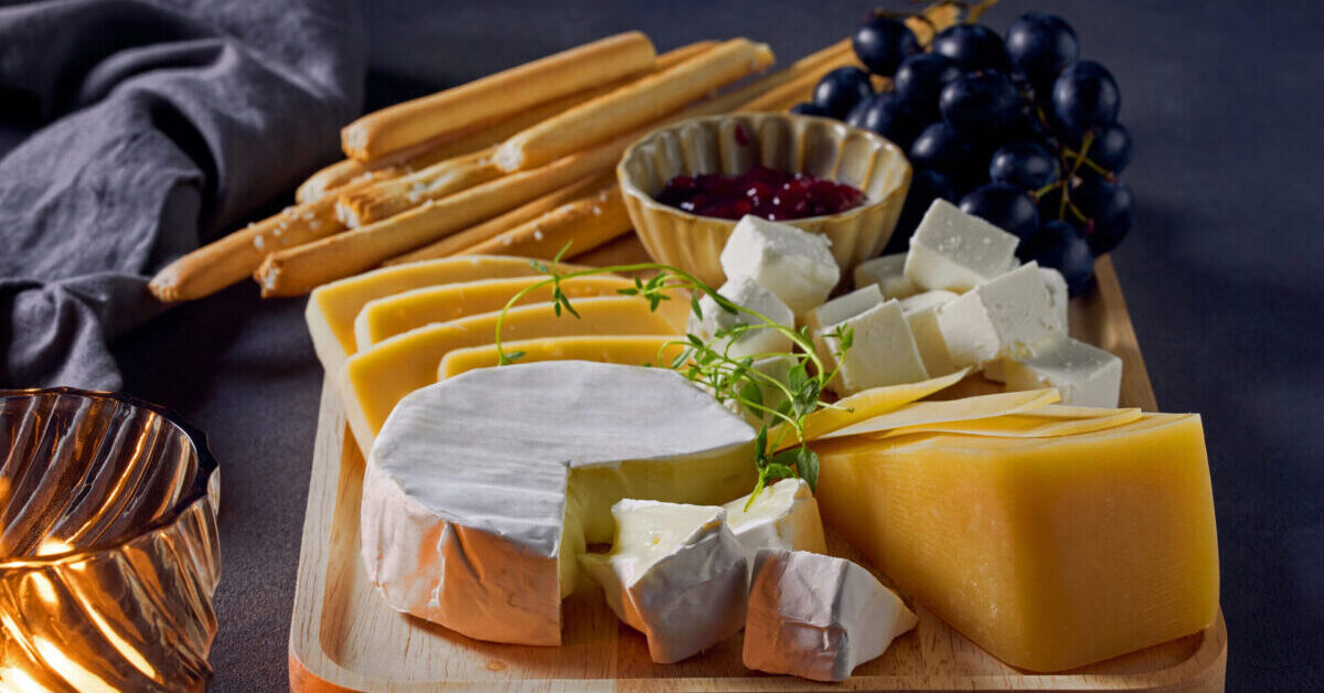 Cheese board with bread sticks.