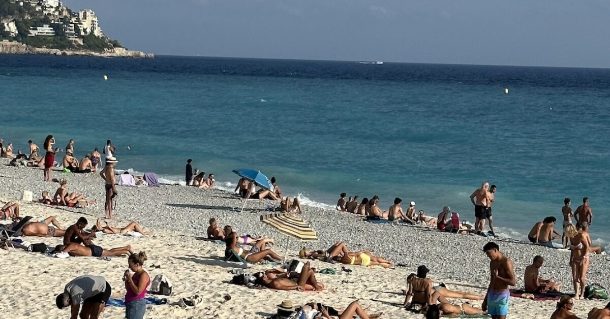 People sunbathing on the beach in Nice