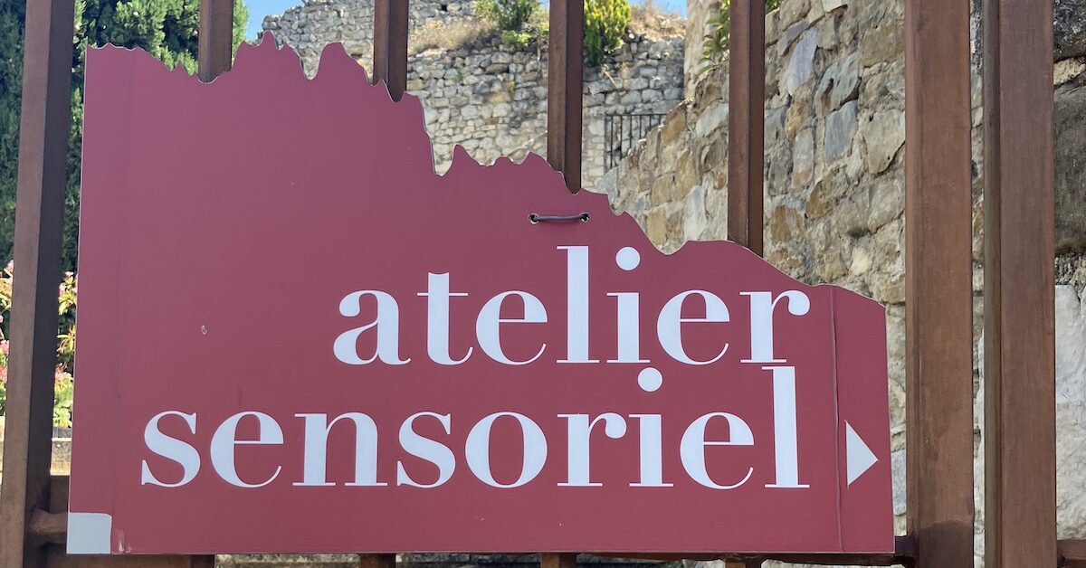 Sign on gate for the Atelier Sensoriel
