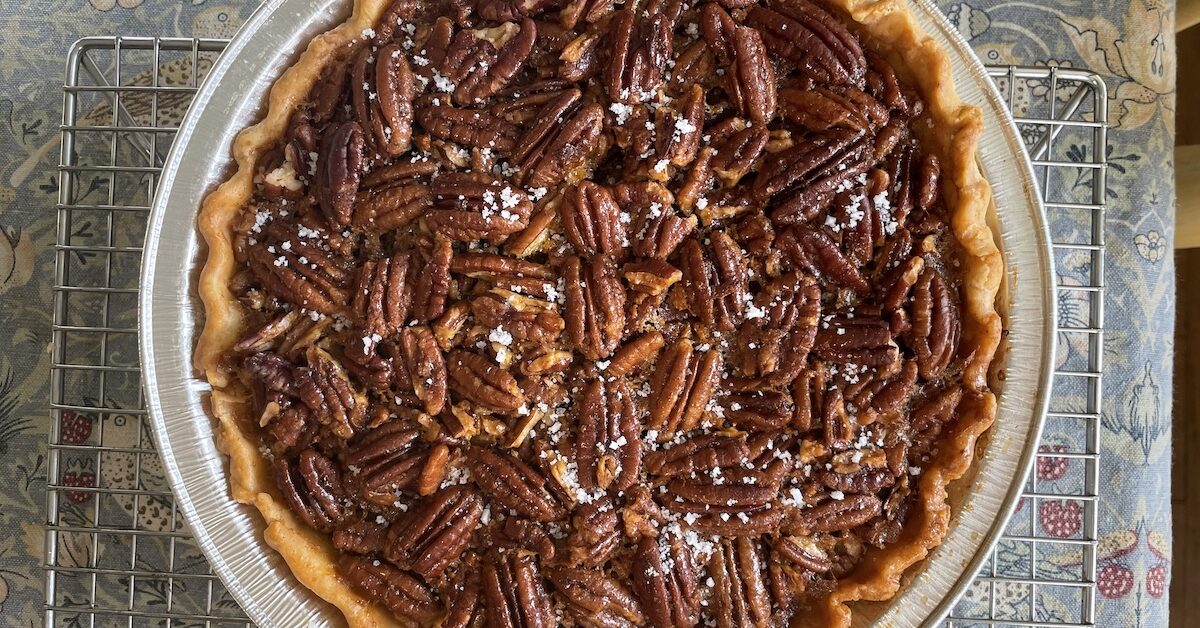 Pecan pie on cooling rack, viewed from above