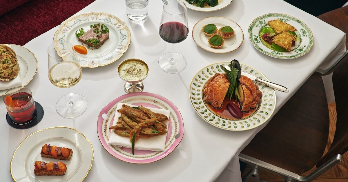 Assortment of dishes on white tablecloth