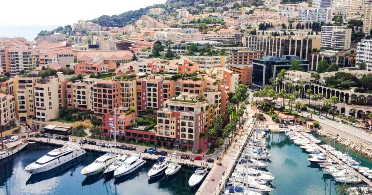 monaco views from cliff with yachts and colorful buildings