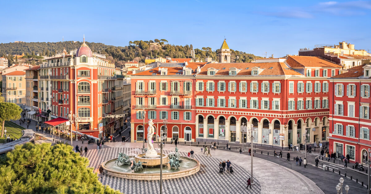 Aerial view of Place Massena square with red buildings and fountain in Nice, France
