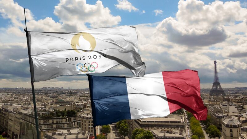 PARIS, FRANCE, March 2023: Top view of flag of french olympics games 2024 with grunge texture. no flagpole. Plane design, layout. official logo of SOG 2024 in Paris