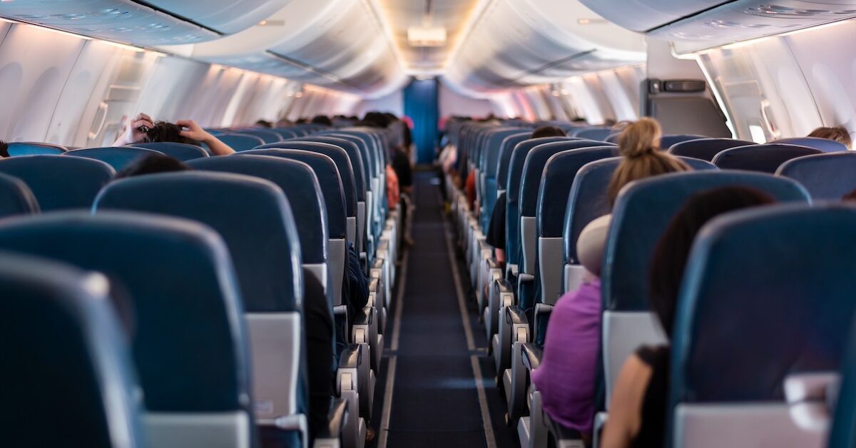 View of airplane seats and passengers