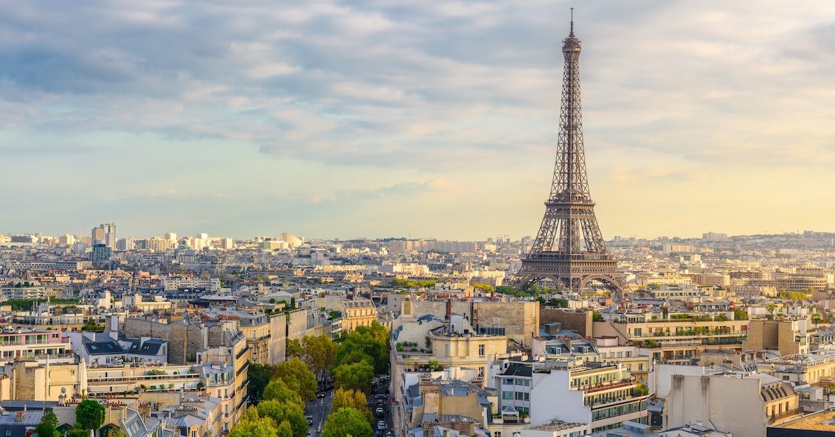 Aerial view of Paris with Eiffel Tower and Champs Elysees from the roof of the Triumphal Arch.